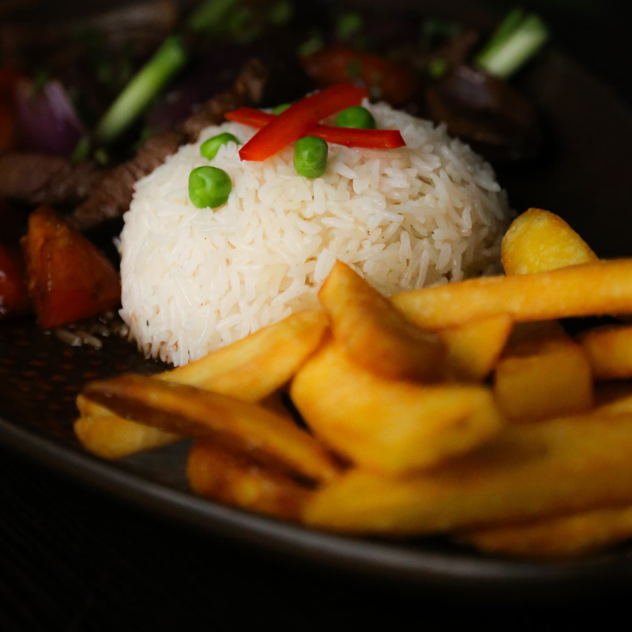 Lomo Saltado with rice and fries